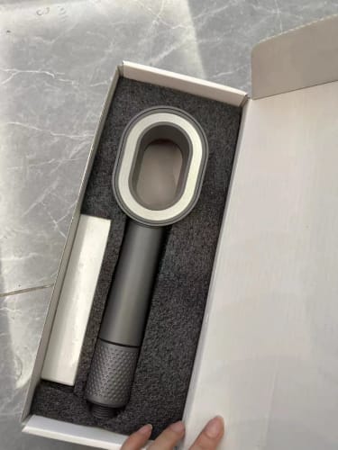 Lavero shower filter being unboxed on a soft neutral surface